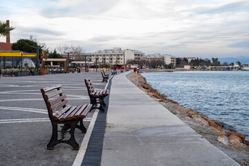Benches on the embankment of the aegean Sea in Turkey. Walking road adn benches by the sea on...
