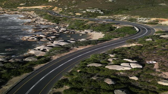 Scenic Aerial View of Winding Road Along Camps Bay Coastline in South Africa