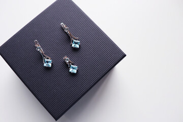 women's accessories. set of silver jewelry with blue stones in a gift box. gift concept for woman