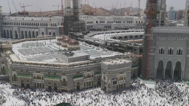 Bird's eye view of Muslim pilgrims exit Masjid Al Haram Mosque via King Abdul Aziz gate in Makkah, Saudi Arabia. Haram Mosque is the holiest mosque in Islam