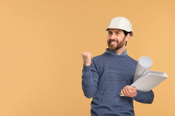 Architect in hard hat with draft and folder on beige background, space for text