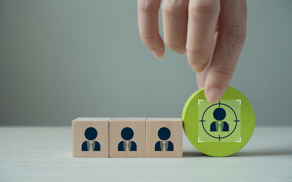 Hand put the wooden cubes focused on personalization icon on grey backgroud and copy space. Personalized marketing concept. Customer behavior and persona. Customization strategy. Customer centric.