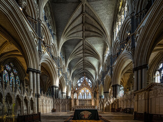 Lincoln Cathedral, Roman Catholic Gothic church and cathedral with stain glass window corridor and hall, with arches, columns, pews, vault, aisles, gallery, arcades and clerestory.