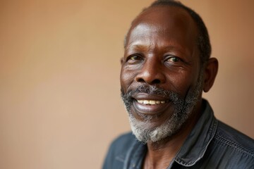 Portrait of a happy senior African man smiling and looking at camera