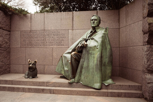 Washington DC - US - Mar 22, 2024 A sculpture of FDR sitting in a wheelchair with Fala, his Scottish Terrier, a part of the Franklin Delano Roosevelt Memorial, located on the Tidal Basi