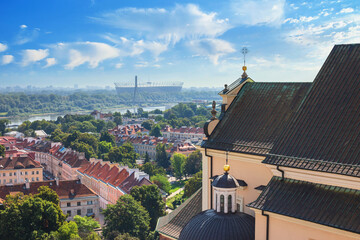 Cityscape - top view of neighbourhood of Powisle from St. Anne's Church near the Vistula river, in center of Warsaw, Poland - obrazy, fototapety, plakaty