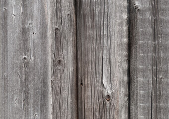 Texture of old weathered planked wooden fence
