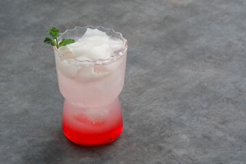 Es Kelapa Muda or young coconut ice with syrup
