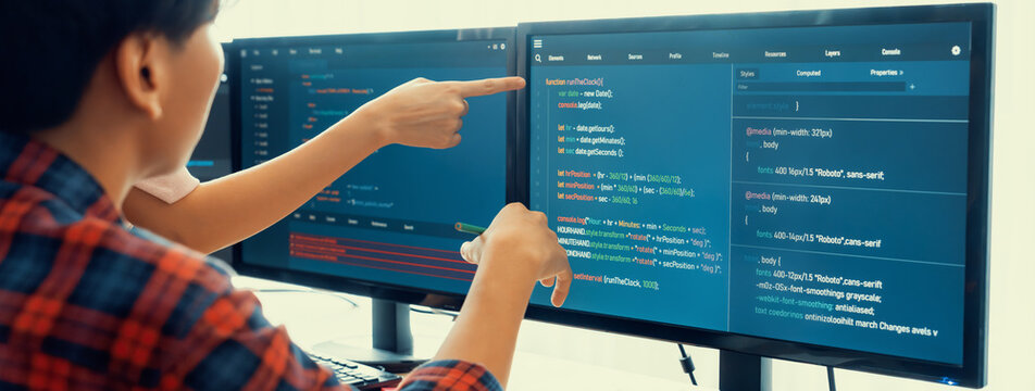 Cropped image of professional programer team collaboration discuss about web coding while coworker point java script displayed on computer at modern company office. Closeup. Burgeoning.