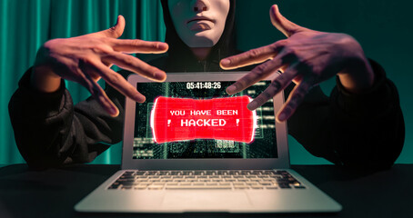 Criminal anonymous mask successful making password encryption by programming hack on laptop of...