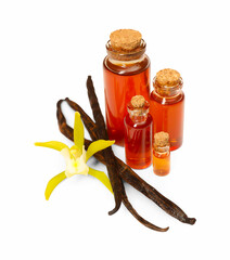 Aromatic vanilla extract, pods and flower isolated on white