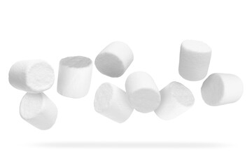 Many yummy marshmallows flying on white background