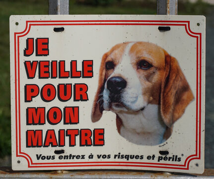 In rural Brittany, in northwestern France, a sign posted on a gate warns to beware of dog. In English, it reads, “I am on watch for my master. You enter at your risk and peril.”