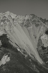 Rocky mountain with different minerals and a triangular shape in Argentine Patagonia, black and...