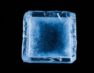 Obraz premium Chrystal clear frosty textured natural ice block in cold light blue tones, isolated on black