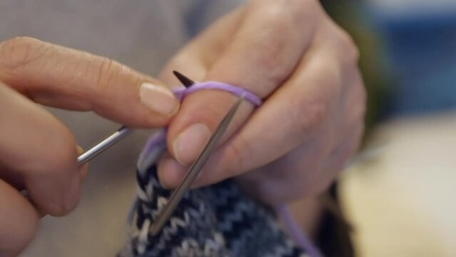 Close-up view: Tubular knitting yarn with a stockinette stich pattern