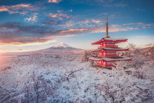 Fujiyoshida, Japan Beautiful view of mountain Fuji and Chureito pagoda at sunrise of Mount Fuji during winter.This is one of the famous spot to take pictures of Mount Fuji.