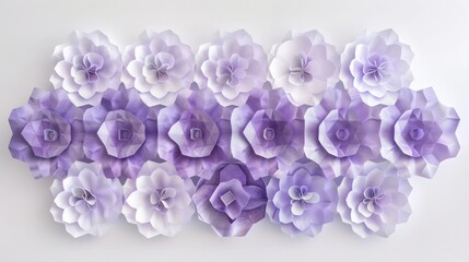 A collection of purple and white paper flowers arranged in a decorative pattern on a light background.