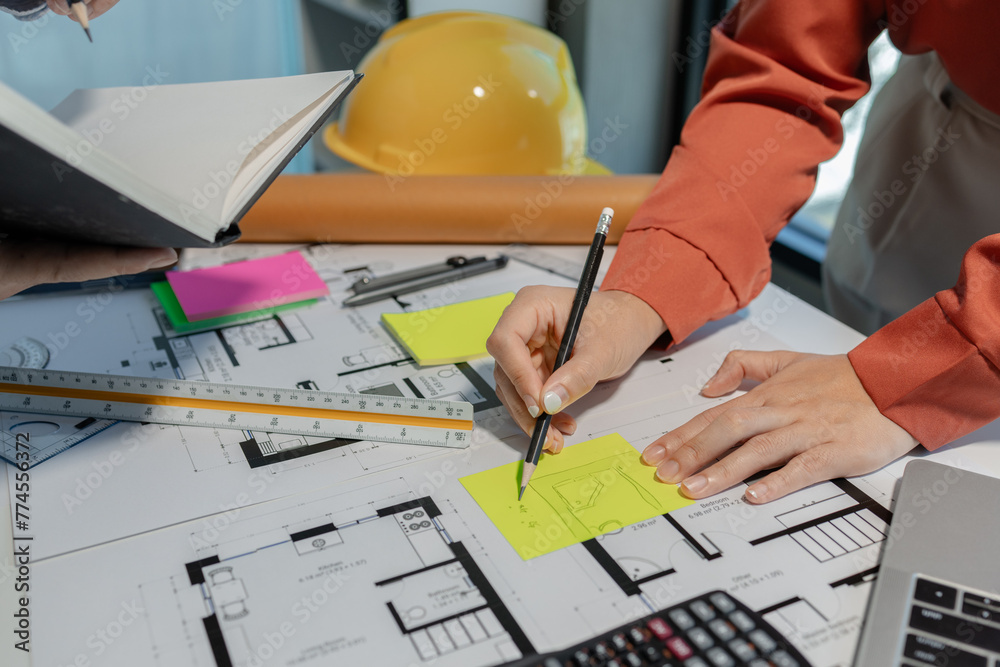 Wall mural an architect and an engineer are discussing the first design sketch of a building they are working o