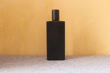 bottle of perfume on a black background