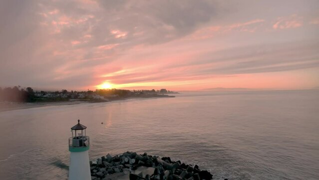 Santa Cruz harbor sunrise with lighthouse