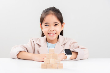 little business girlplacing wooden blocks