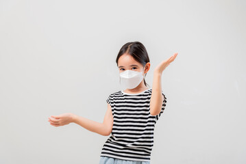 Coronavirus Covid-19.Little asian kid girl wearing face mask Happy at home.