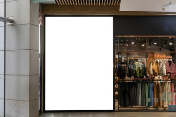 Mockup large blank LED billboard banner at front of showroom of clothes store