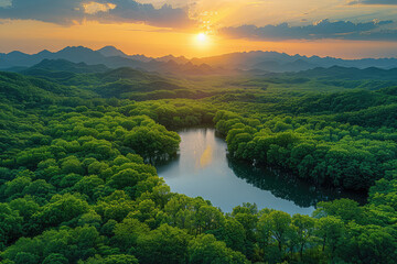 Aerial view of the sunset over Rongkun Lake in Xinghua Forest, featuring dense green forests and mountains in southern China. Created with Ai