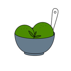 A bowl of green ice cream with a spoon in it