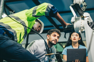 Robotic engineer and team oversee software, machine tool performance, enhance program for efficiency © SpaceOak