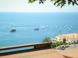 View from the city wall to the city port sailboats and tourist ships in the old city of Antalya in Turkey