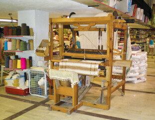 An antique well-preserved wooden loom on display in a hardware store in Antalya city in Turkey.