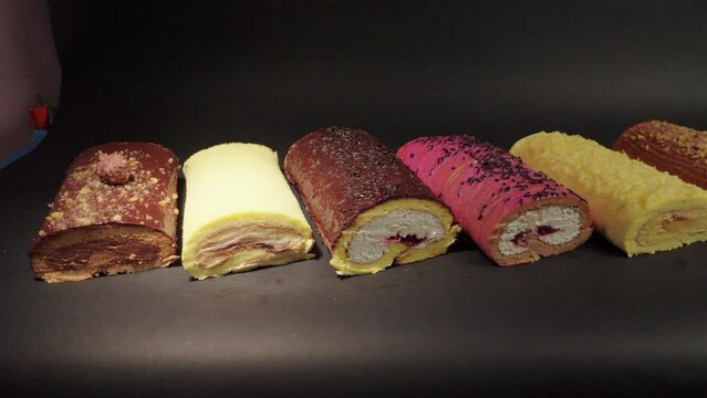 cake rolls brazo gitano swiss roll desserts collection chocolate ferrero cheese butter jelly berries cherry with black background