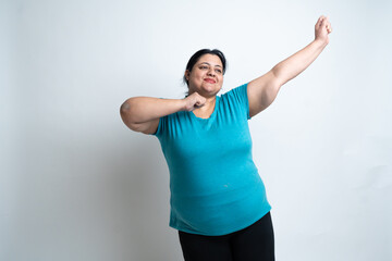 Overweight fat indian woman cheering with open arms. isolated over white background. Plus size female. Healthcare Concept. Copy Space