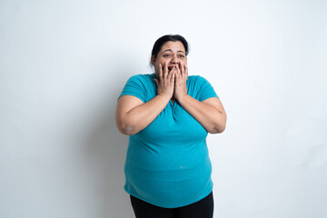 Overweight fat indian woman feeling excited or surprised after weight loss. isolated over white...