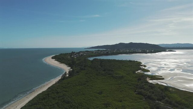 Drone image going up and discovering Daniela beach, in Florianopolis, the island of magic.