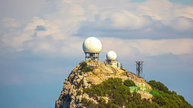 Iconic landmark cloudy background, Rock of Gibraltar timelapse, radar station closeup