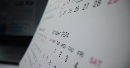 Closeup of desk calendar for 2024 on office desk