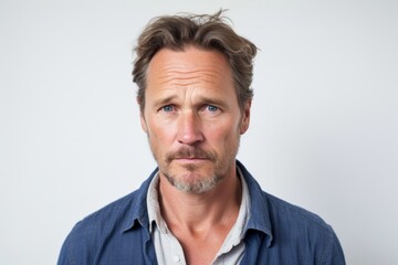 Fototapeta premium Portrait of a handsome mature man looking at camera with serious expression