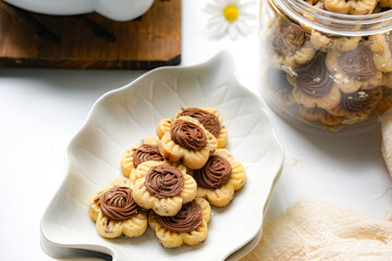Popular cookies in Malaysia and Singapore during celebration of Eid Mubarak (Hari Raya) on white background. Selective focus and blurry.