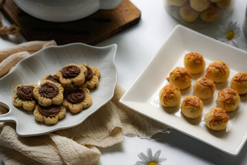 Popular cookies in Malaysia and Singapore during celebration of Eid Mubarak (Hari Raya) on white background. Selective focus and blurry.