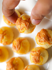 Popular cookies in Malaysia and Singapore during celebration of Eid Mubarak (Hari Raya) on white background. Selective focus and blurry.