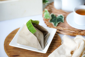 Nasi lemak, a Malay style complete meal of fragrant rice cooked in coconut milk, wrapped in banana...