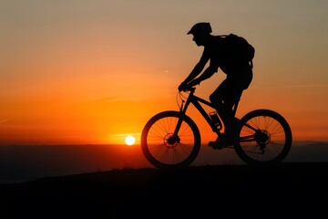 Obraz na płótnie Canvas shot Silhouette of a man on mountain bike at sunset photo