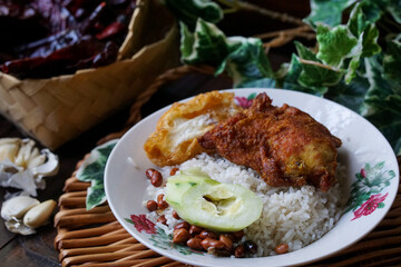 Nasi lemak, a Malay style complete meal of fragrant rice cooked in coconut milk
