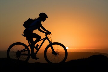 Silhouetted sunrise mountain biker girl, outdoor adventure, cycling hobby