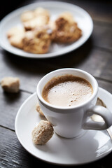 Cup of coffee on rustic wooden background. Copy space.