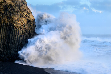 Heavy waves on the ocean during sunset - Reynisfjara beach on Iceland