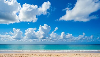 Fototapeta na wymiar A beach with a blue sky and white clouds